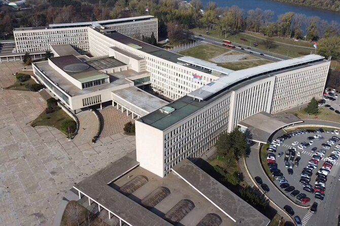 E-Scooter Communist Yugoslavia Tour - Stop 2: Palace of Serbia as a communist-era landmark